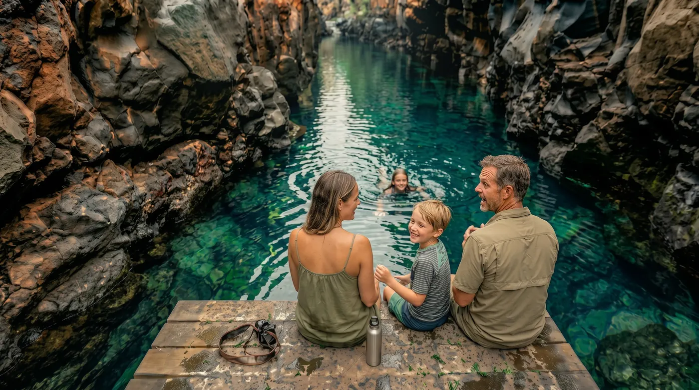 A family explores the crystal-clear waters of Las Grietas, one of Santa Cruz’s most memorable natural swimming spots